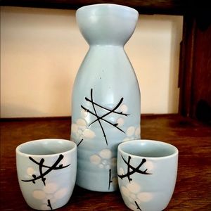 Saki bottle with two cups